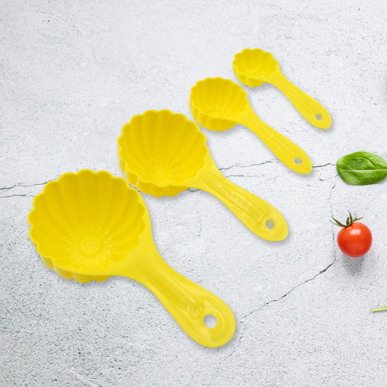 Ladoo mould spoon set in yellow, featuring multiple sizes for easy sweet preparation