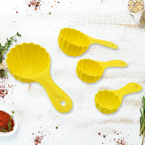 Yellow ladoo mould spoon set for making shaped sweets and snacks in the kitchen