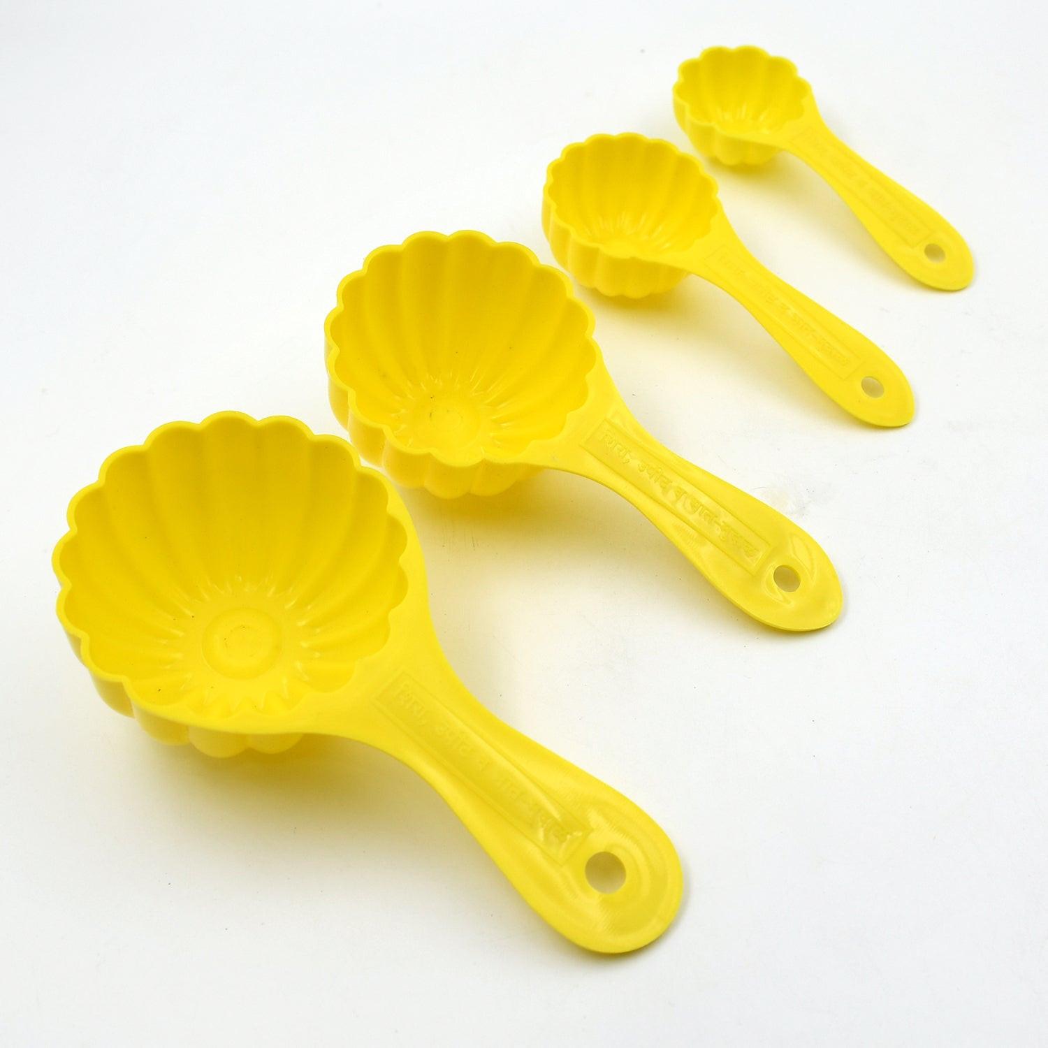 Ladoo mould spoon set in yellow, featuring four sizes for easy dessert preparation