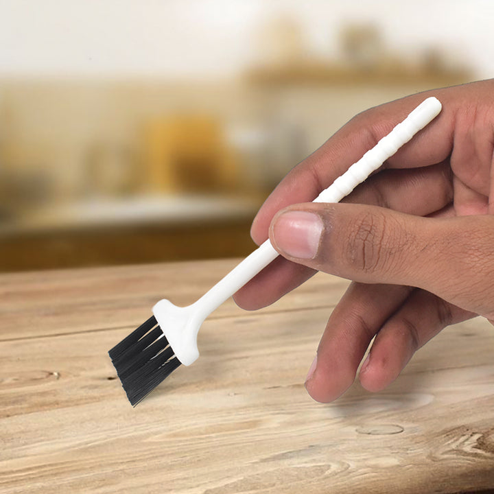 White laptop keyboard brush with durable bristles for effective cleaning of keyboard dust and debris