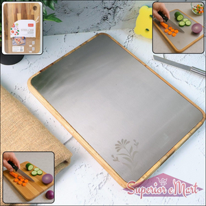Large stainless steel cutting board with bamboo edges and vegetables being sliced for meal prep