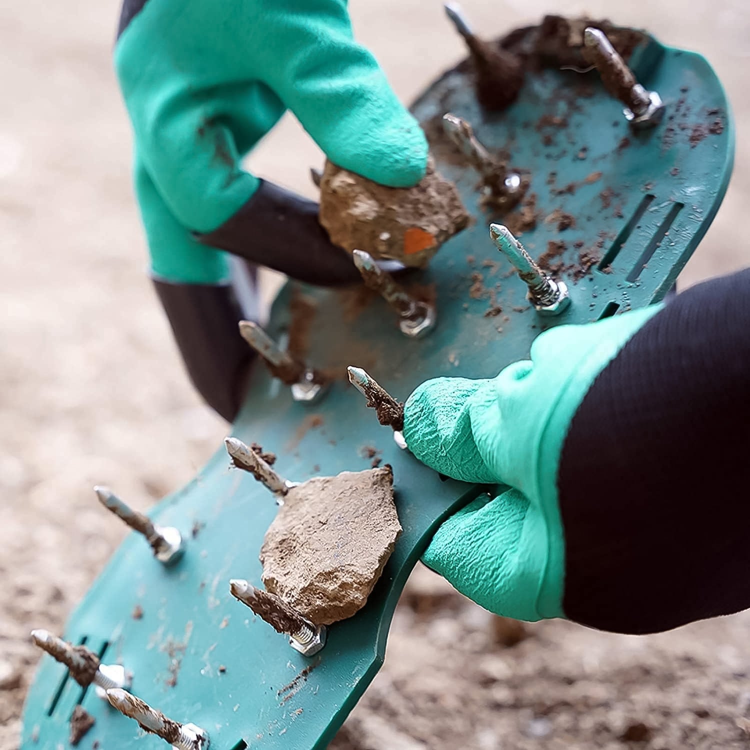 Superior eMart lawn aerator sandals being worn while removing debris for optimal lawn care