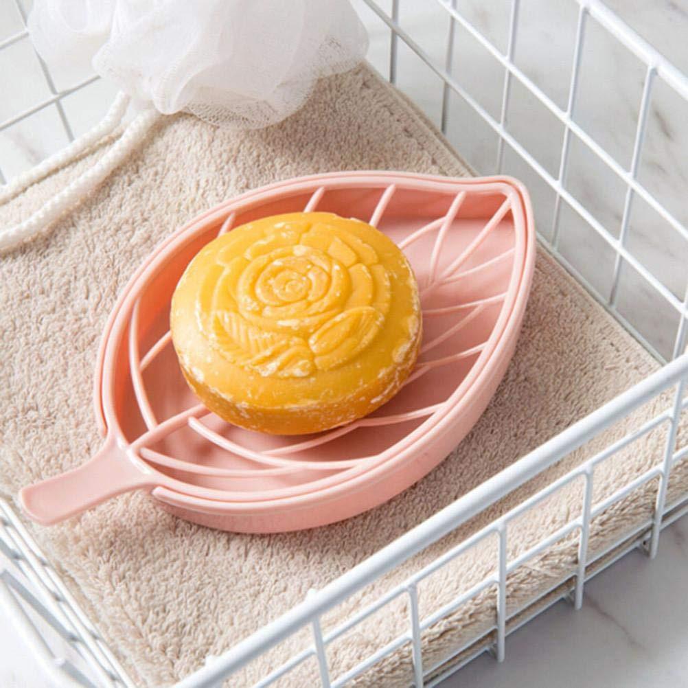 Leaf shape soap holder in pink with a round handcrafted soap displayed on a soft towel