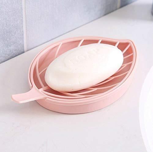 Leaf shape soap holder in pink with a bar of soap resting on its slotted surface