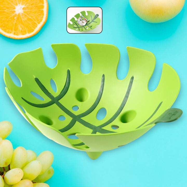 Superior eMart green leaf shaped fruit basket with decorative cutouts holding fresh fruits