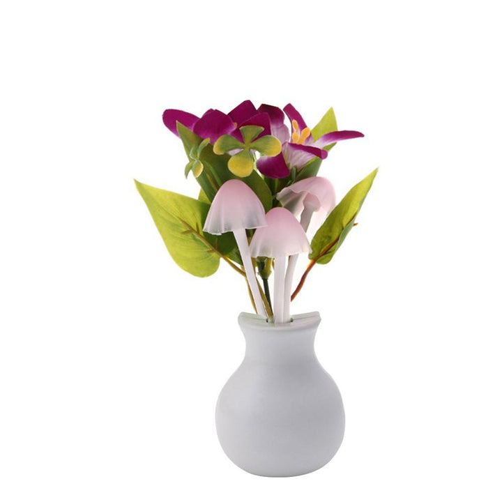 Decorative vase with purple flowers and LED mushroom night light for a cozy ambiance