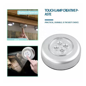 Stick-on LED tap lamp featuring a touch sensor for easy illumination in any space