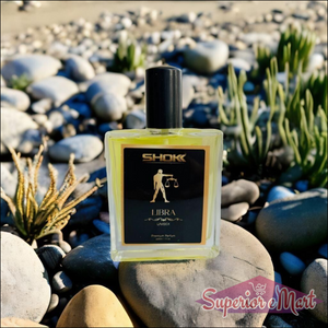 Libra Zodiac Unisex Perfume 50ml in a stylish bottle placed on a rocky beach setting