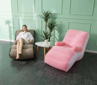 Luxury Inflatable Lounger Chair in pink and white beside a brown chair, ideal for relaxation and comfort.