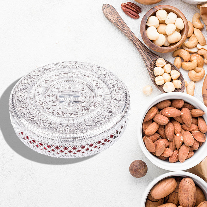 Elegant dry fruit storage container with intricate design, perfect for organizing nuts and snacks