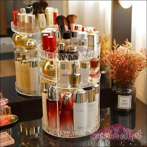 Tiered 360-degree clear acrylic rotating makeup organizer with diamond trim holding SK-II and Shiseido products.
