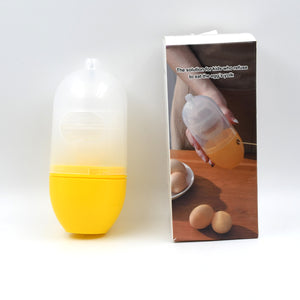 Manual egg scrambler in yellow with packaging for easy egg preparation in the kitchen