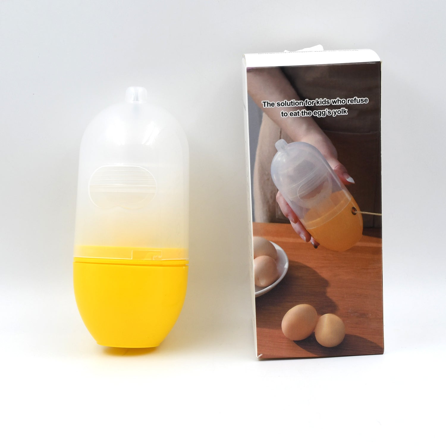 Manual egg scrambler in yellow with packaging for easy egg preparation in the kitchen