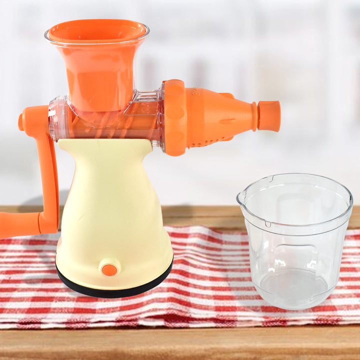 Superior eMart manual fruit juicer for home in orange and cream with clear juice container on wooden table