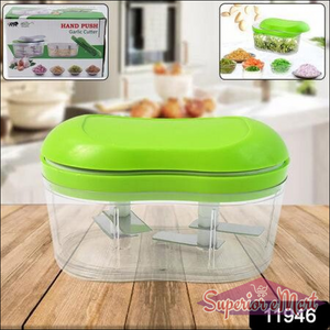 Manual garlic chopper in green with clear container for easy food preparation in the kitchen