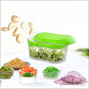 Manual garlic chopper with green lid and clear container, ideal for chopping garlic and herbs quickly