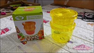Manual citrus juicer and grinder set in bright yellow with stacked containers for easy storage