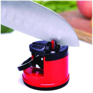 Manual kitchen knife sharpener in red for easy and effective blade sharpening at home