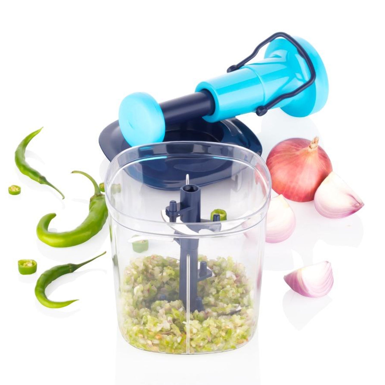Manual vegetable chopper in blue with chopped green peppers and onions in the container