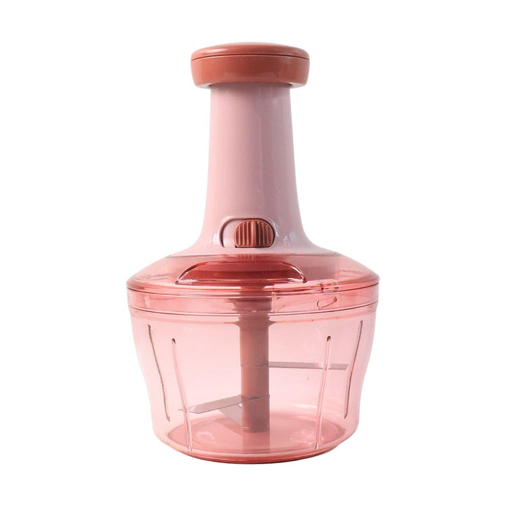 Manual vegetable chopper in pink with ergonomic handle for easy chopping and food preparation