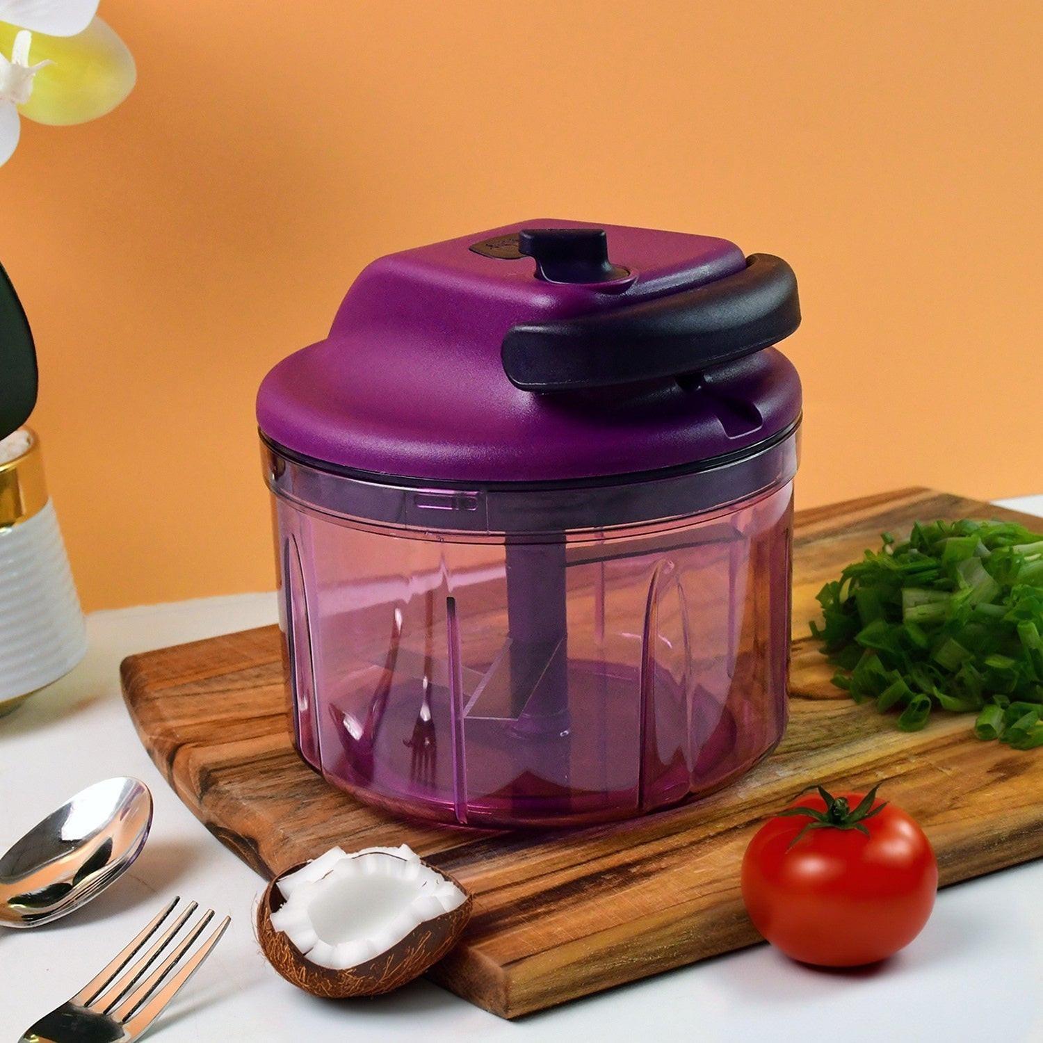 Manual vegetable chopper in purple with easy grip handle for chopping veggies quickly and efficiently