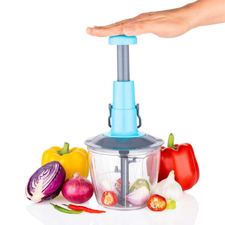 Manual vegetable chopper with a hand-operated top, chopping colorful vegetables for easy meal prep