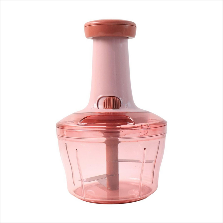 Manual vegetable chopper in pink with ergonomic handle for easy chopping and food preparation