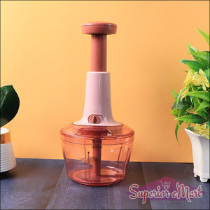 Manual vegetable chopper with easy-grip handle and transparent bowl for efficient food preparation