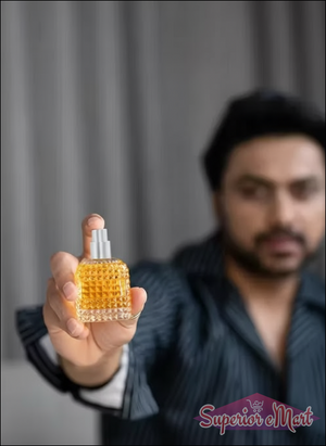 Luxury unisex perfume long-lasting in a stylish glass bottle held by a man in a striped shirt