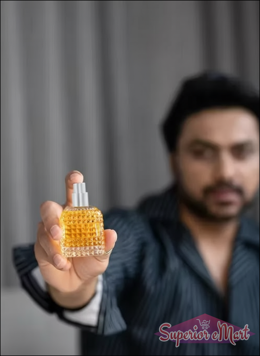 Luxury unisex perfume long-lasting in a stylish glass bottle held by a man in a striped shirt
