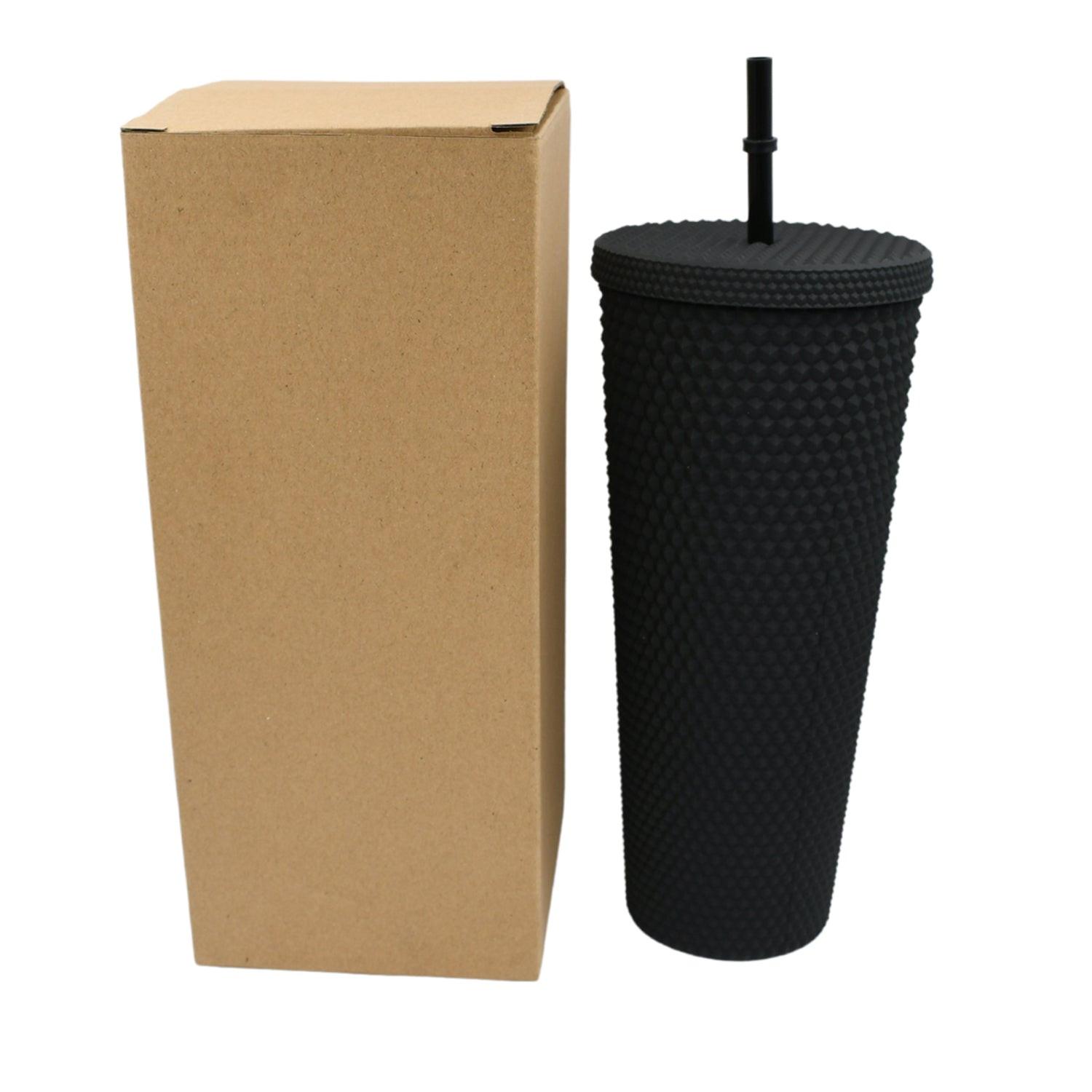 Matte studded tumbler with straw in black with a brown cardboard packaging for drinks on the go