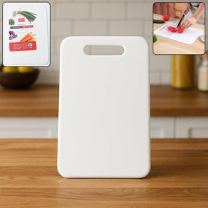 White medium chopping board with easy-grip handle for food preparation in the kitchen
