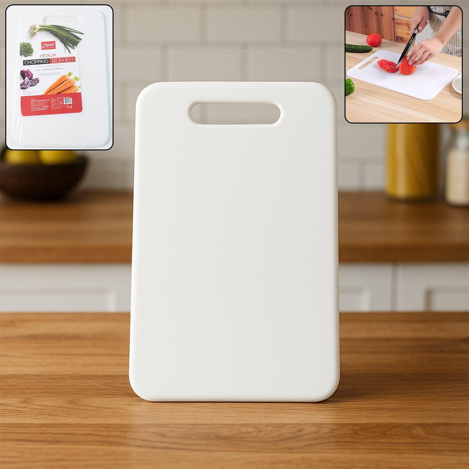 White medium chopping board with easy-grip handle for food preparation in the kitchen