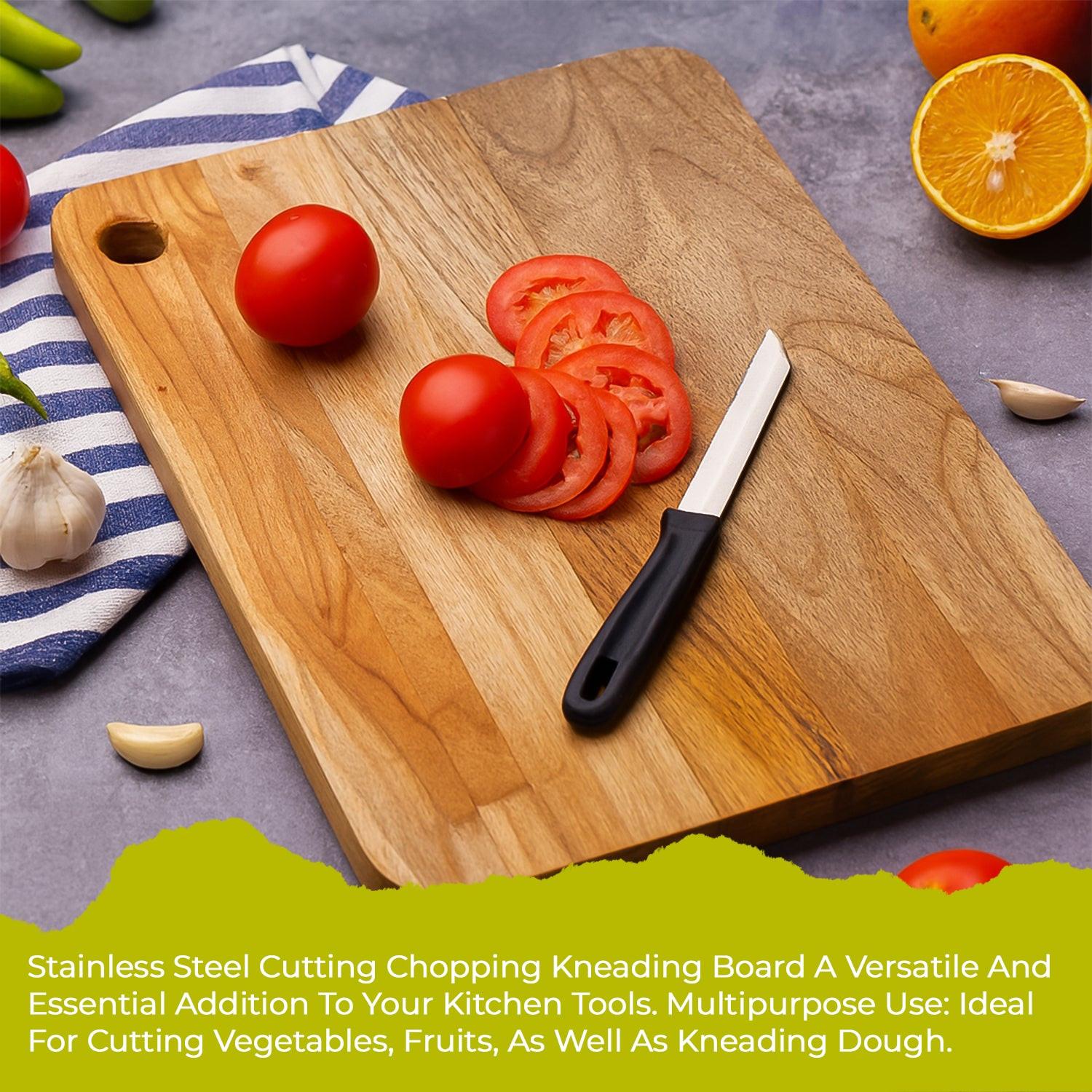 Medium cutting board with wooden handle featuring sliced tomatoes and a knife on a colorful kitchen surface