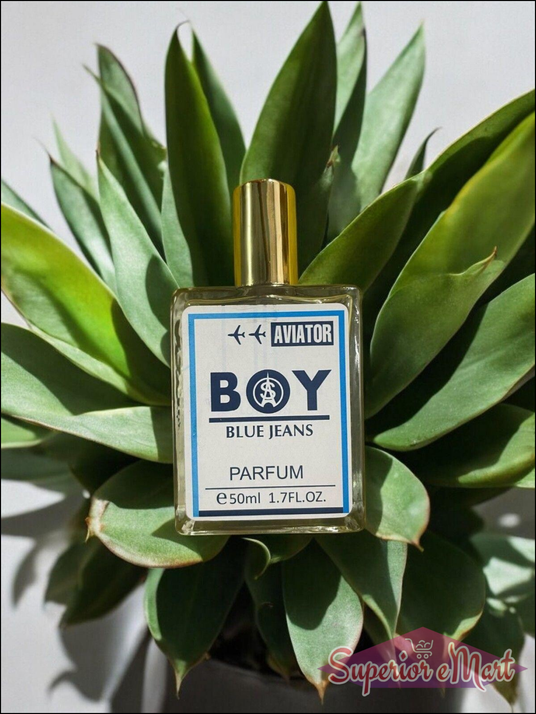 Aviator BOY Blue Jeans Fragrance 50ml bottle placed among green plants for a fresh look