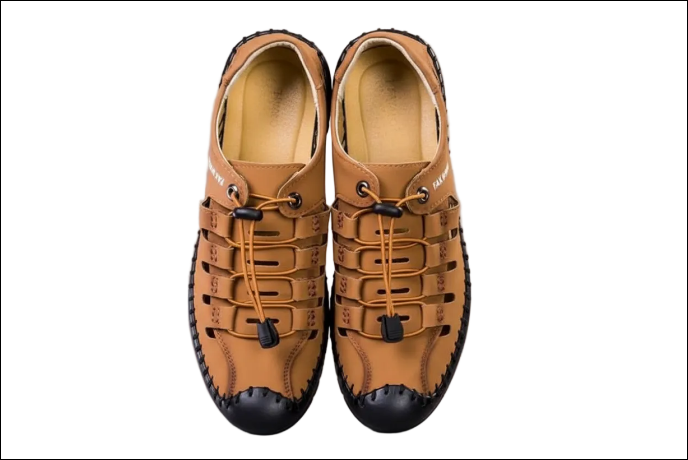 Pair of tan leather shoes with black soles on a gray background