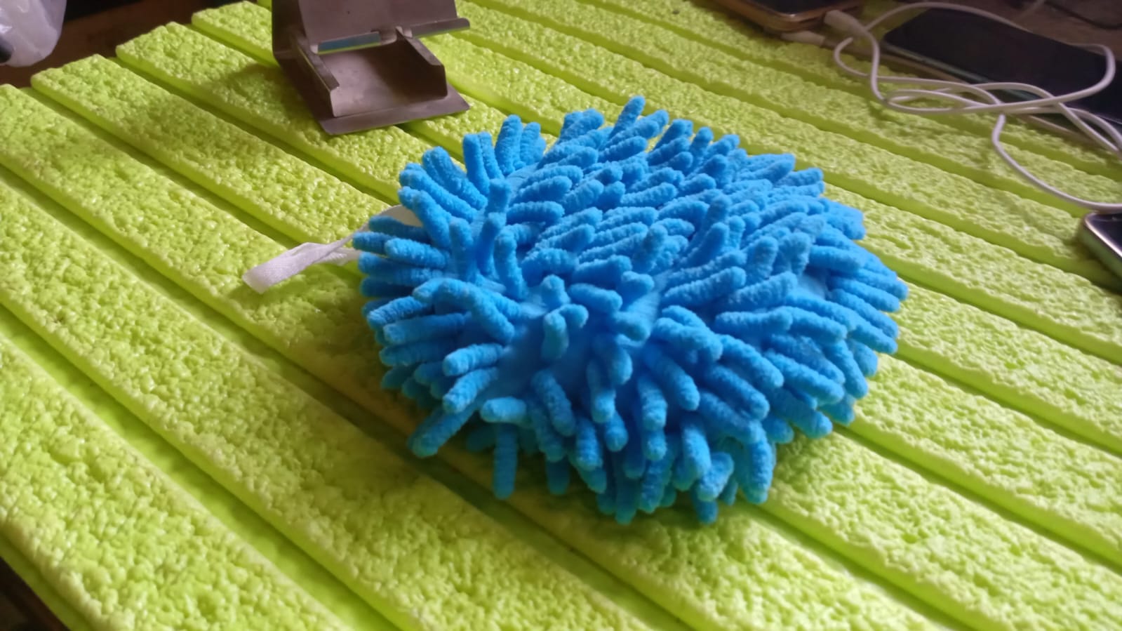 Bright blue microfiber cleaning duster for effective dusting on various surfaces