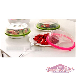 Microwave food cover splatter lid available in green and pink for preventing messes while heating food