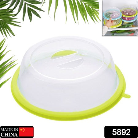 Microwave food cover splatter lid in clear and green, designed to keep food protected in the microwave