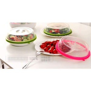 Microwave food cover splatter lid available in green and pink for preventing messes while heating food