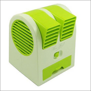 Compact green mini air conditioner for home with dual air vents for efficient cooling