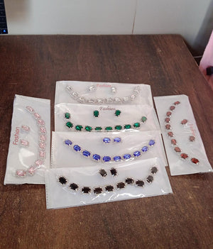 Mixed color jewelry set featuring various bracelets in elegant packaging for stylish accessories
