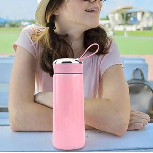Stylish pink leak proof glass water bottle with a durable cap and handle for easy carrying