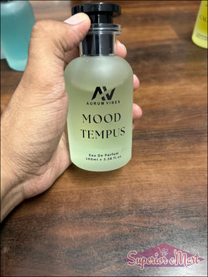 Aurum Vibes Mood Tempus unisex perfume 100ml bottle with a sleek design on a wooden surface