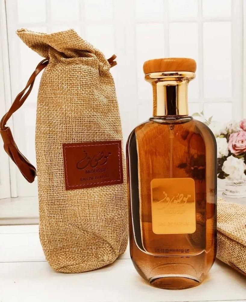 Mousuf inspired unisex perfume in elegant bottle with natural cork cap and decorative packaging