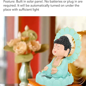 Moving head Buddha ornament with built-in solar panel, ideal for outdoor home decor