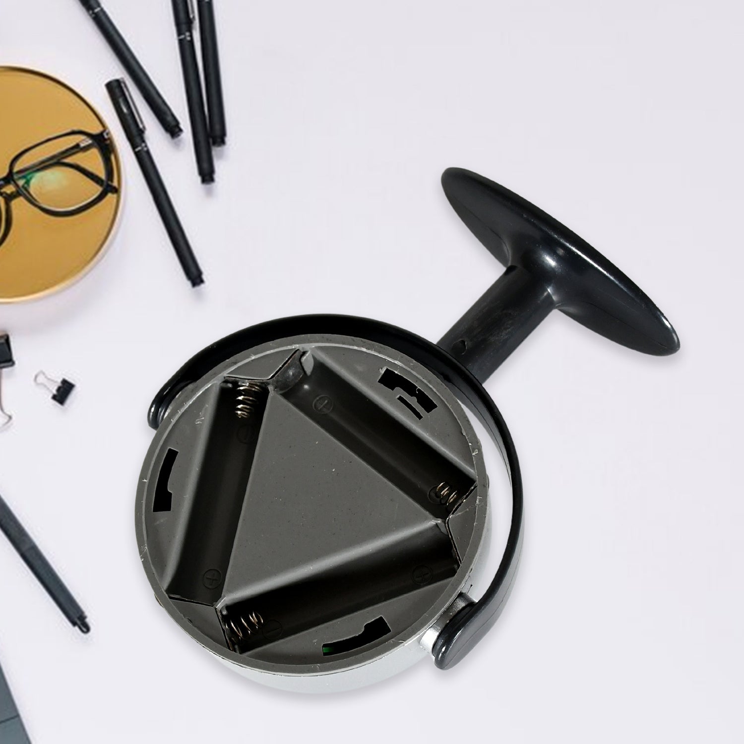 Multifunctional magnetic LED flashlight with a sturdy base and battery compartment for versatile lighting