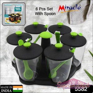 Revolving spice rack set with six containers and spoons for organized kitchen storage