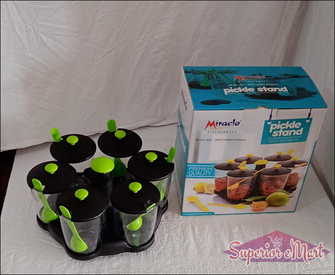 Revolving spice rack set with clear containers and green lids for easy access and organization