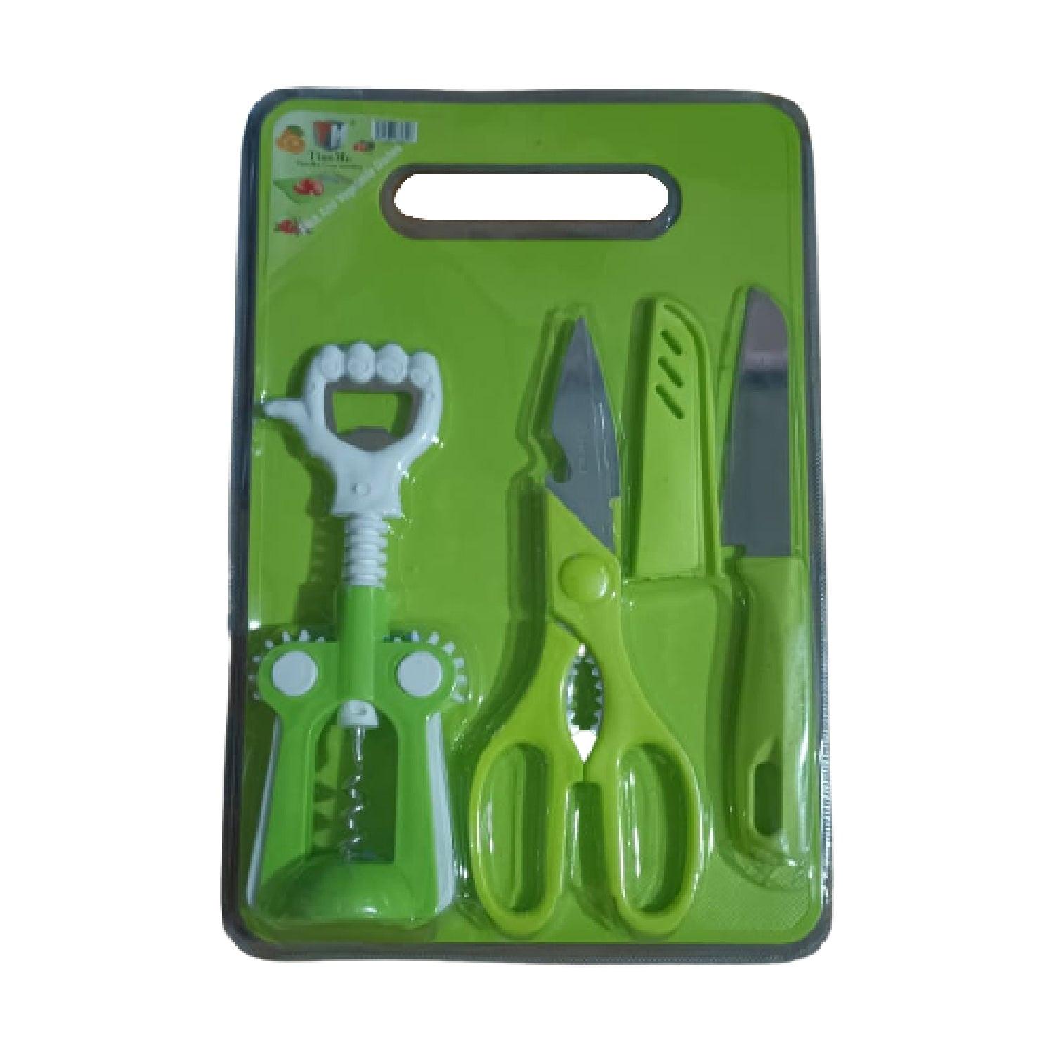 Multipurpose chopping board set with green kitchen tools including scissors, knives, and a peeler